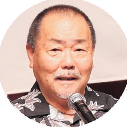 7月10日号記事4_隈部会長近影